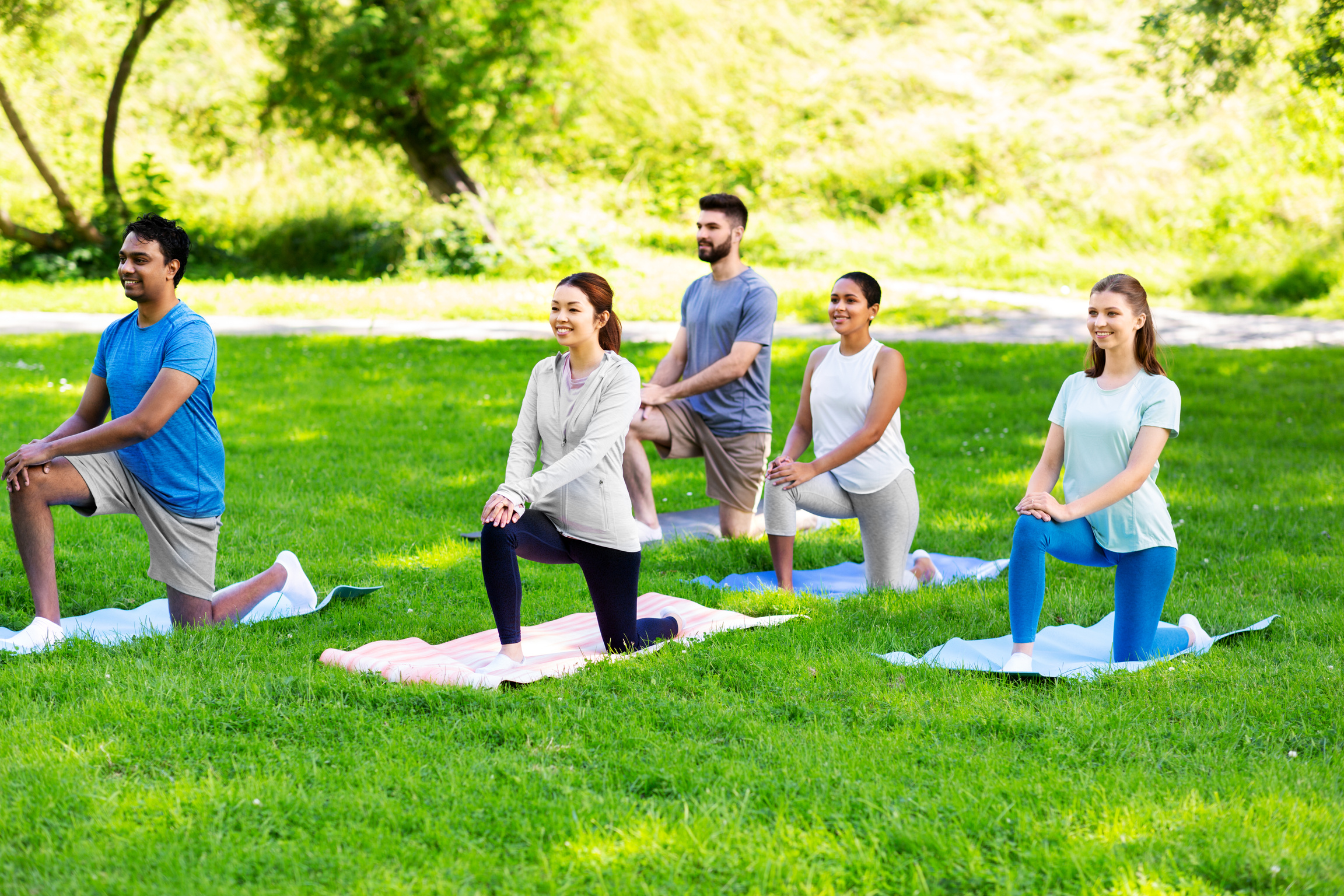Group of People Doing Yoga at Summer Park